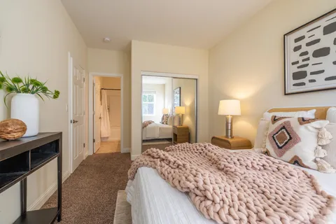 a view of staircase with wooden door and mirror