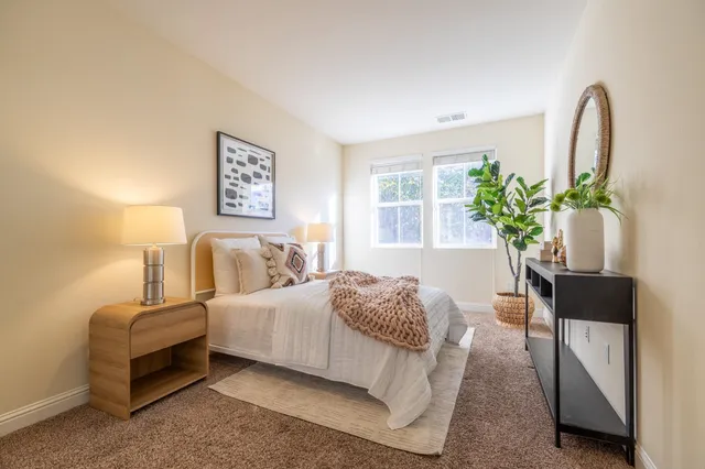 a view of staircase with wooden door and mirror