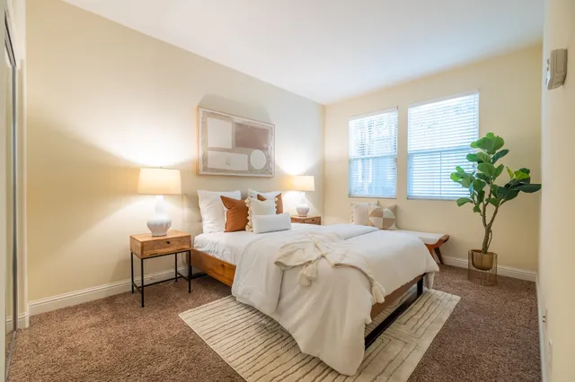 a bedroom with bed and a window