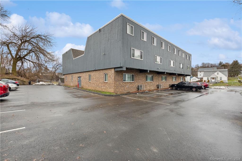 511 High Street, Unit 203B New Britain, CT 06053 - Photo 1 of 1 a view of street with parked cars