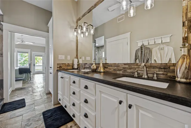 a bathroom with a shower and a sink