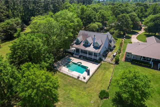 a utility room with cabinets washer and dryer