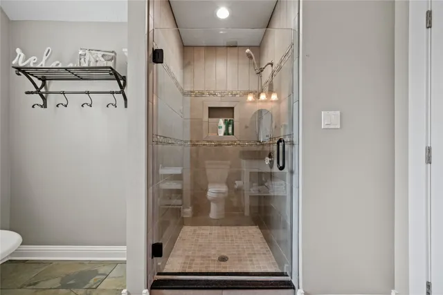 a living room with lots of furniture and a wooden floor