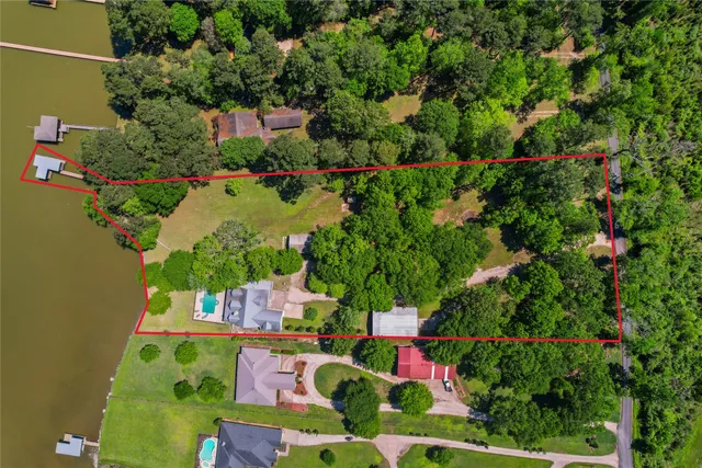 an aerial view of swimming pool outdoor seating and yard