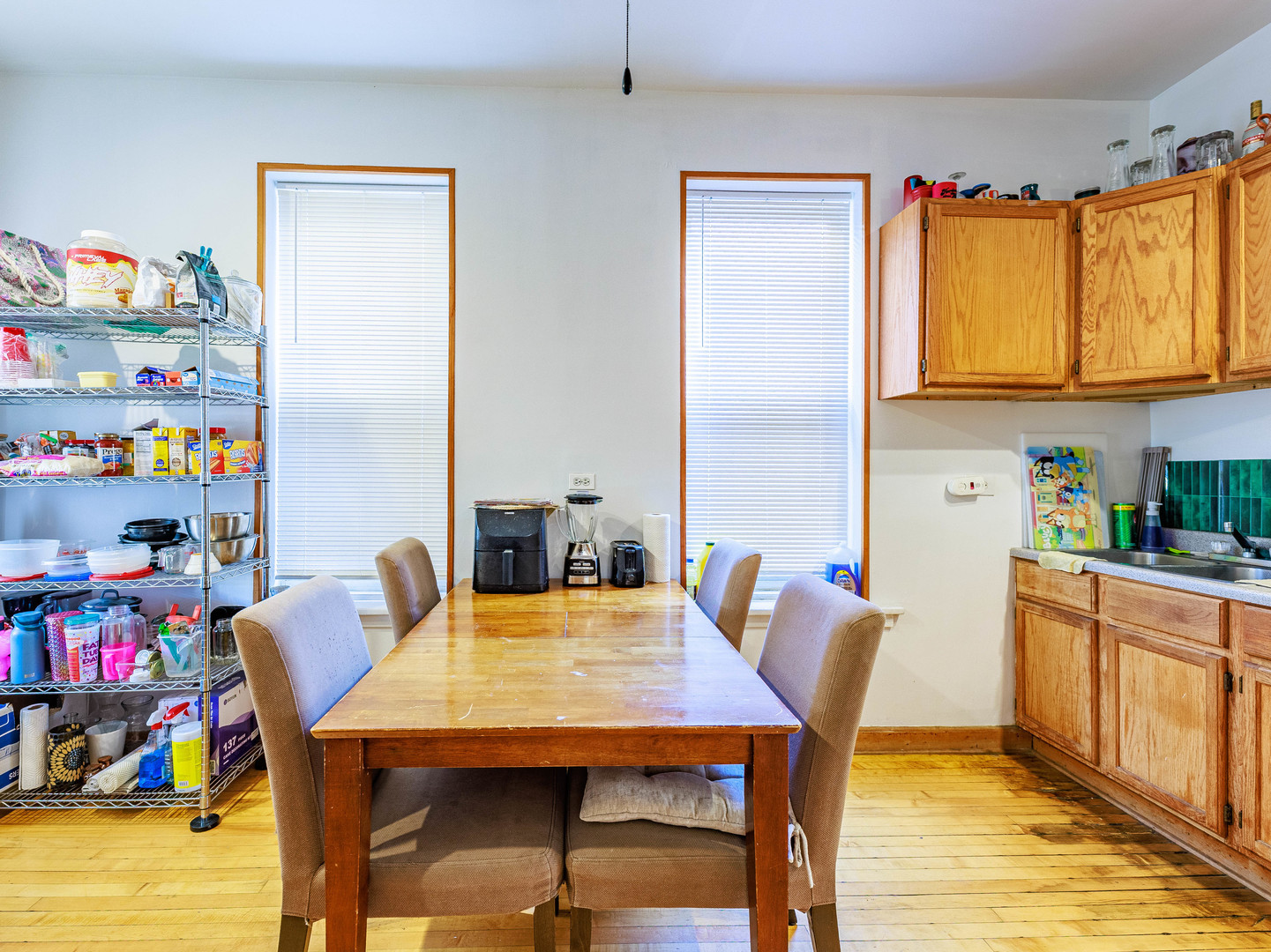 2016 West 22nd Place Chicago, IL 60608 - Photo 13 of 21 a view of a dining room with furniture and a kitchen