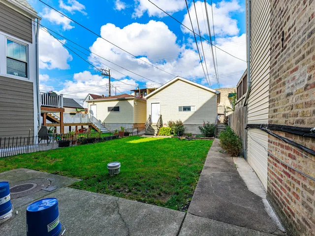 a view of a patio with a yard