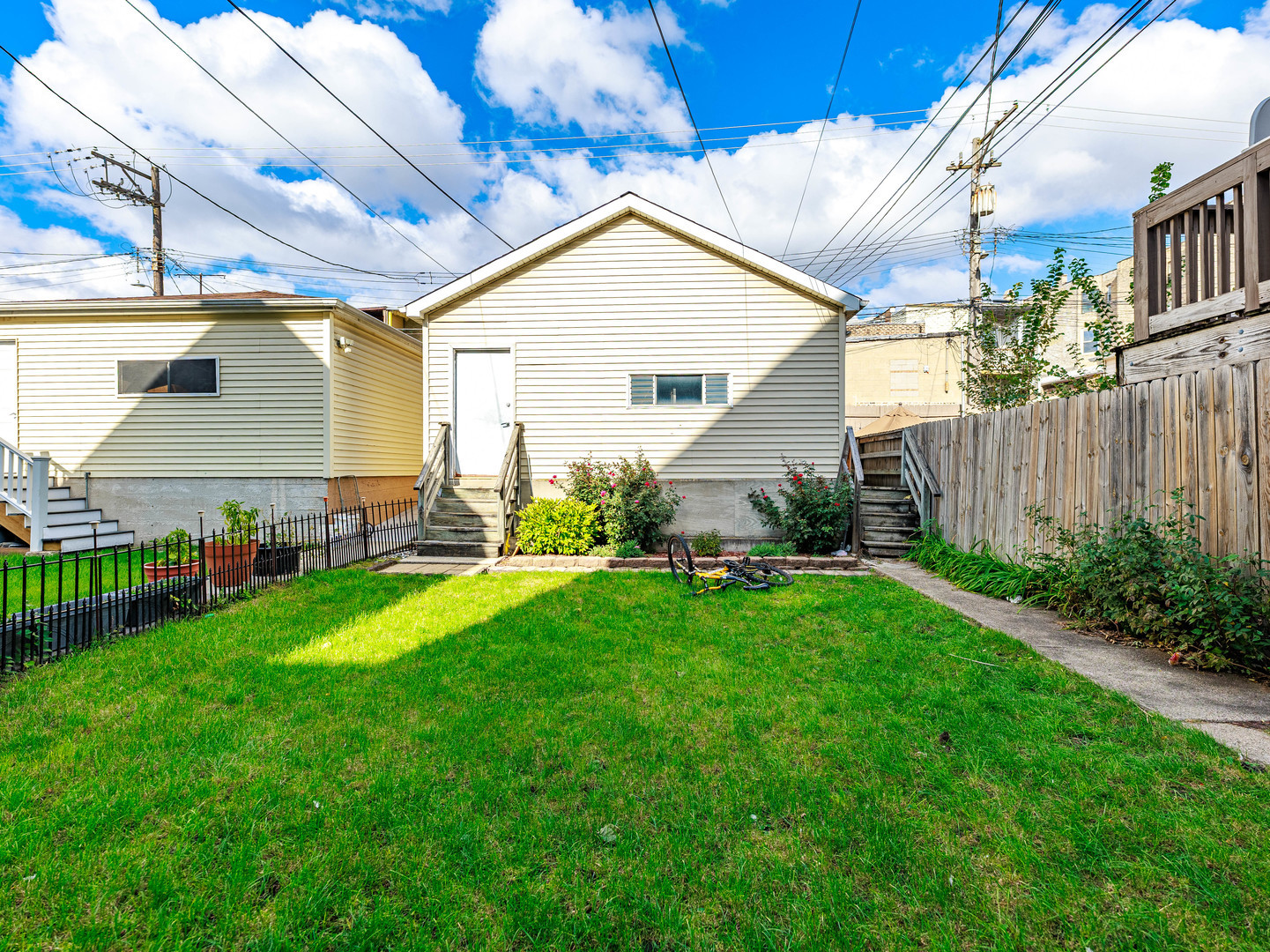 2016 West 22nd Place Chicago, IL 60608 - Photo 18 of 21 a view of backyard with table and chairs and potted plants