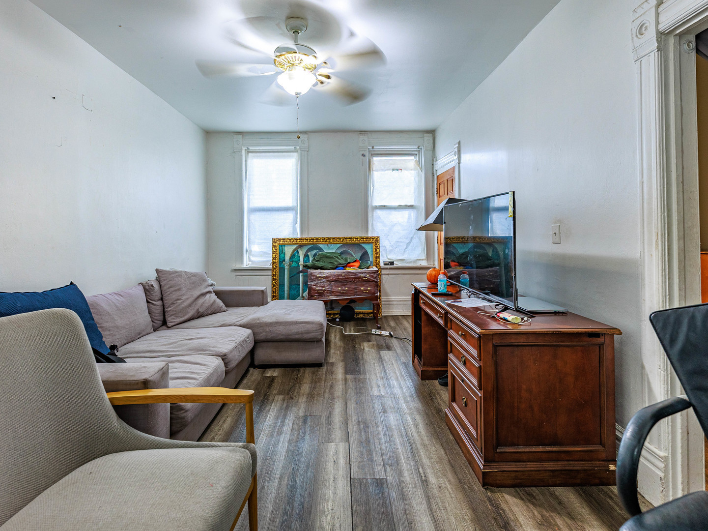 2016 West 22nd Place Chicago, IL 60608 - Photo 2 of 21 a living room with furniture and a flat screen tv