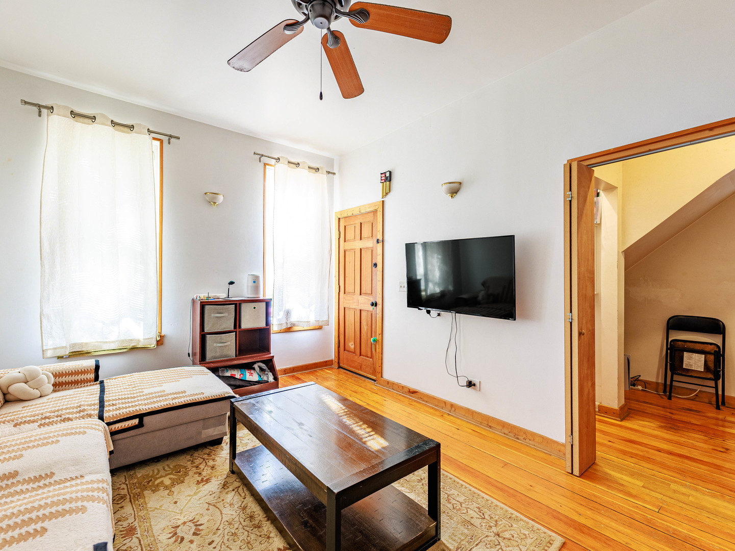 2016 West 22nd Place Chicago, IL 60608 - Photo 7 of 21 a living room with furniture and a flat screen tv