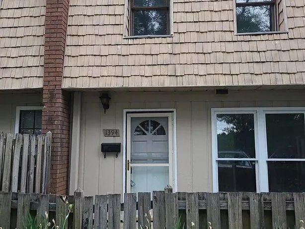 a brick house with a street