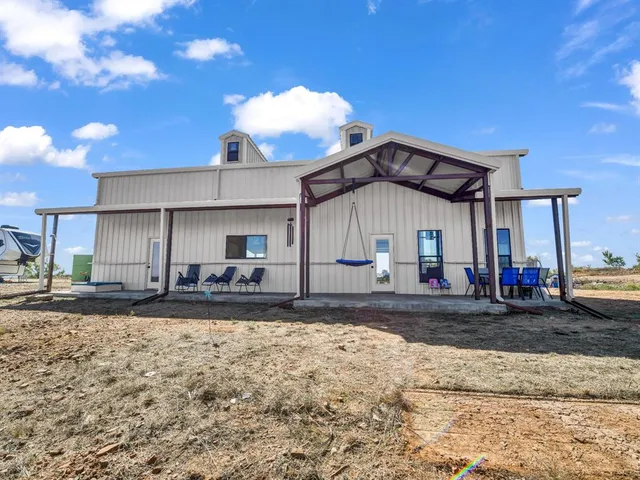 a house view with a backyard space