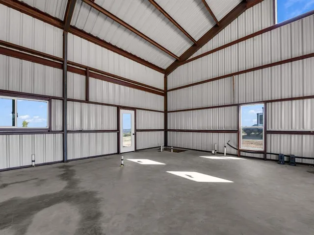 a view of a house with a tree