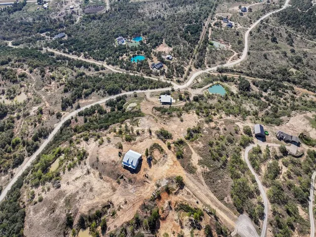 a view of entryway with a small yard