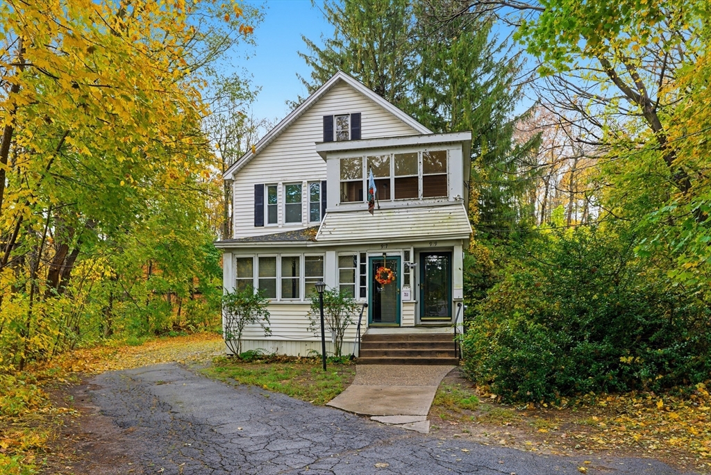 917 Elm Street West Springfield, MA 01089 - Photo 1 of 20 a front view of a house with a yard and trees