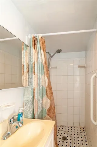 a bathroom with a bathtub and shower
