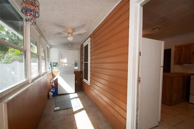 a view of a porch with wooden floor and stairs