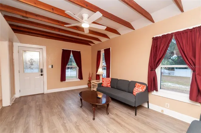 a living room with furniture and a window