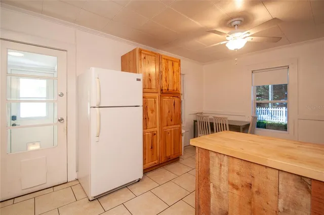 a bedroom with a bed dresser and a window