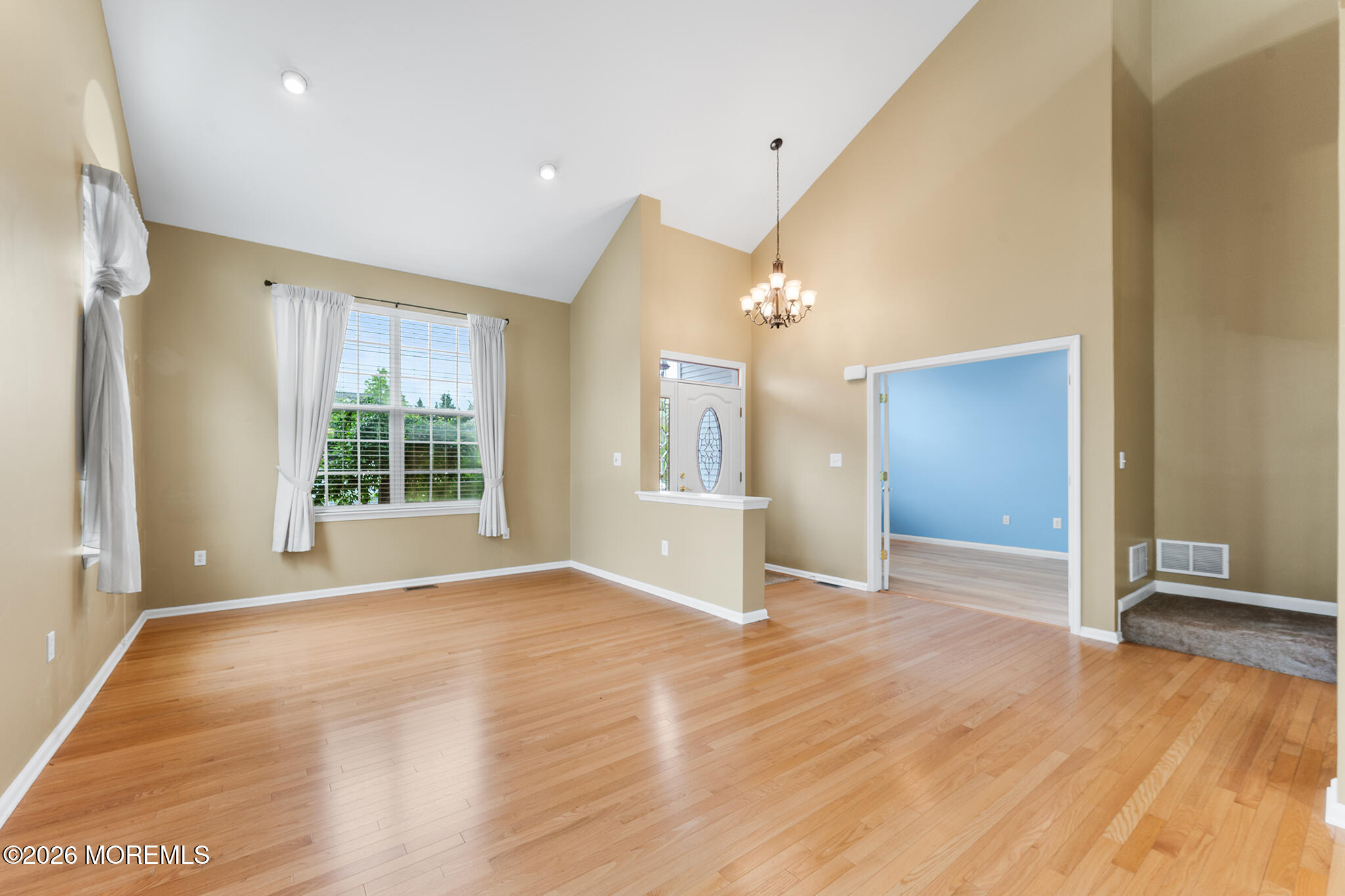 7 Brattleboro Road Jackson, NJ 08527 - Photo 6 of 62 an empty room with wooden floor and windows