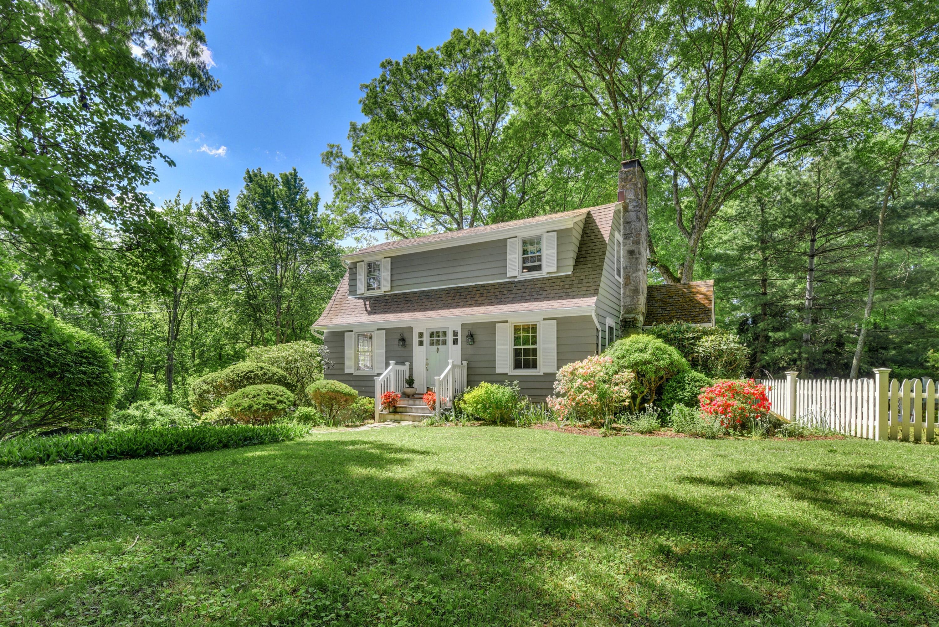 93 Westport Road Wilton, CT 06897 - Photo 1 of 31 a front view of a house with garden