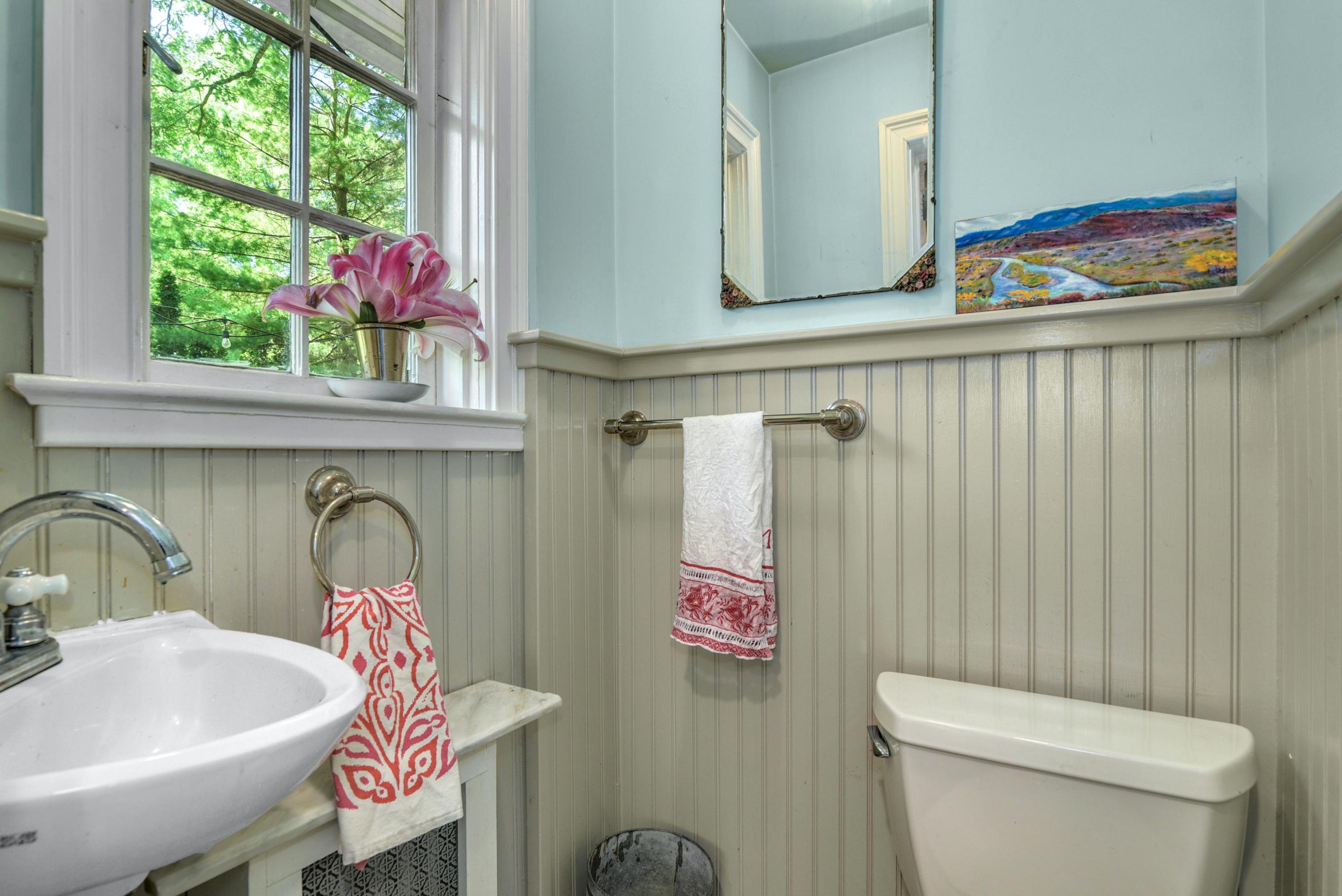 93 Westport Road Wilton, CT 06897 - Photo 12 of 31 a bathroom with a sink a toilet and a window