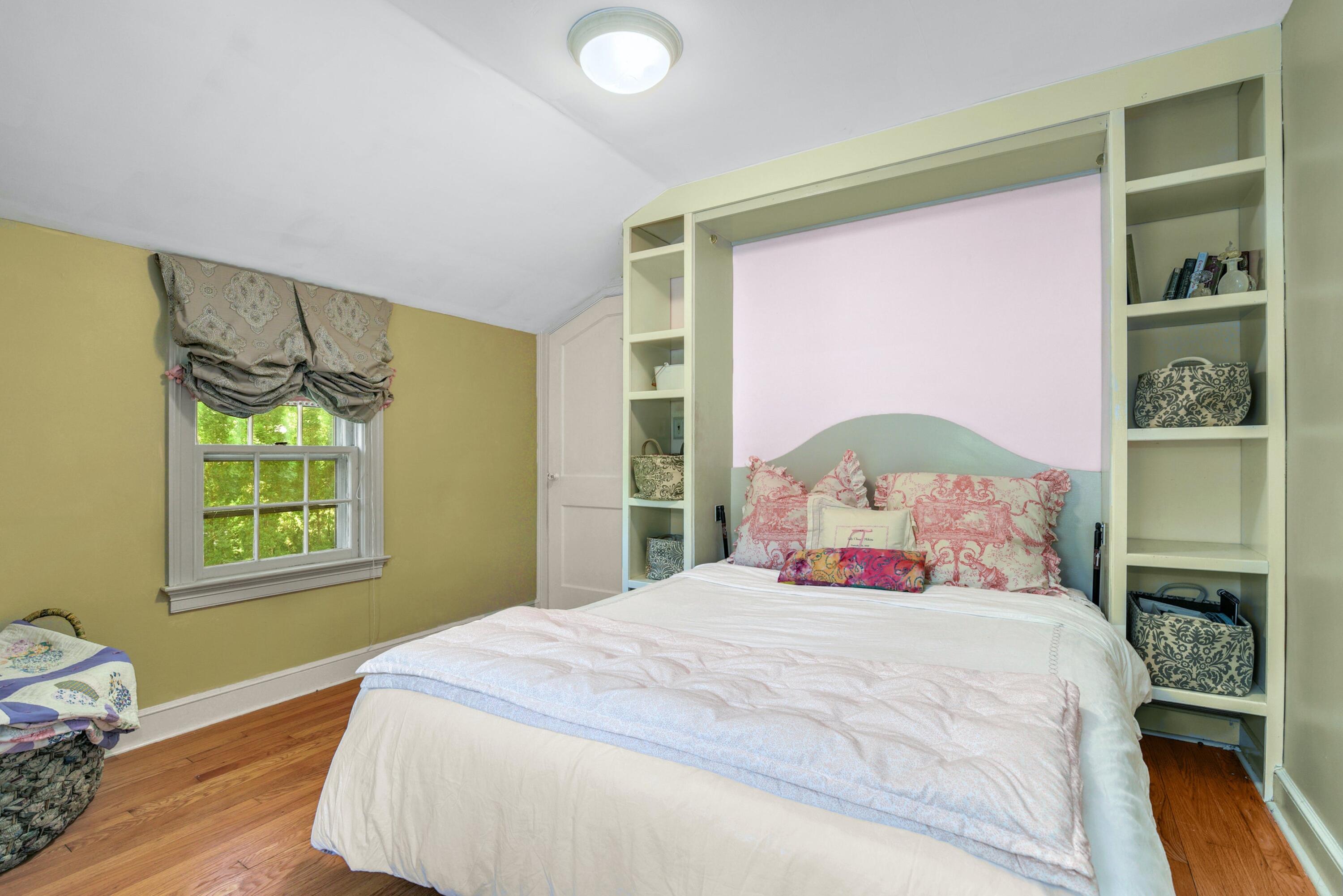 93 Westport Road Wilton, CT 06897 - Photo 17 of 31 a bedroom with a large bed and a window