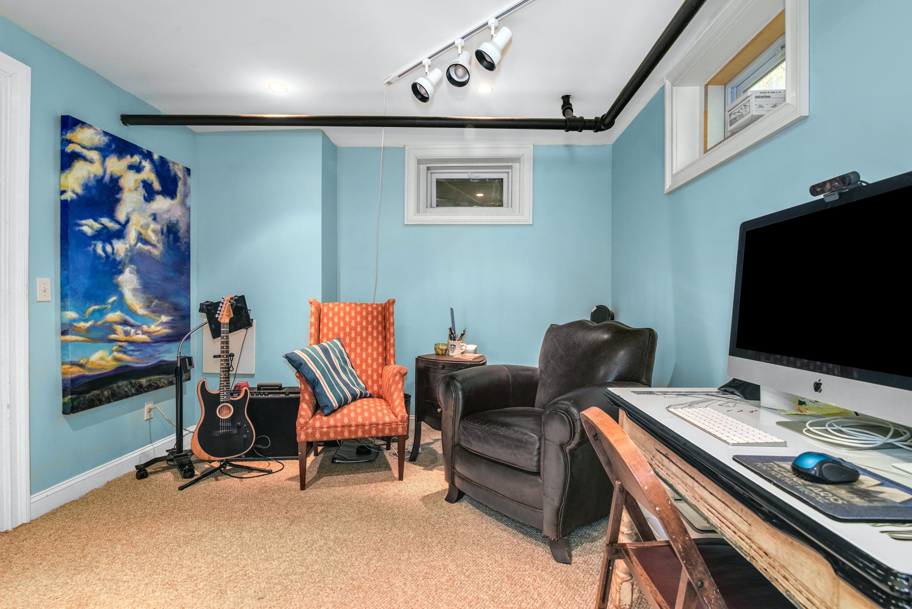 93 Westport Road Wilton, CT 06897 - Photo 20 of 31 a living room with furniture and a flat screen tv