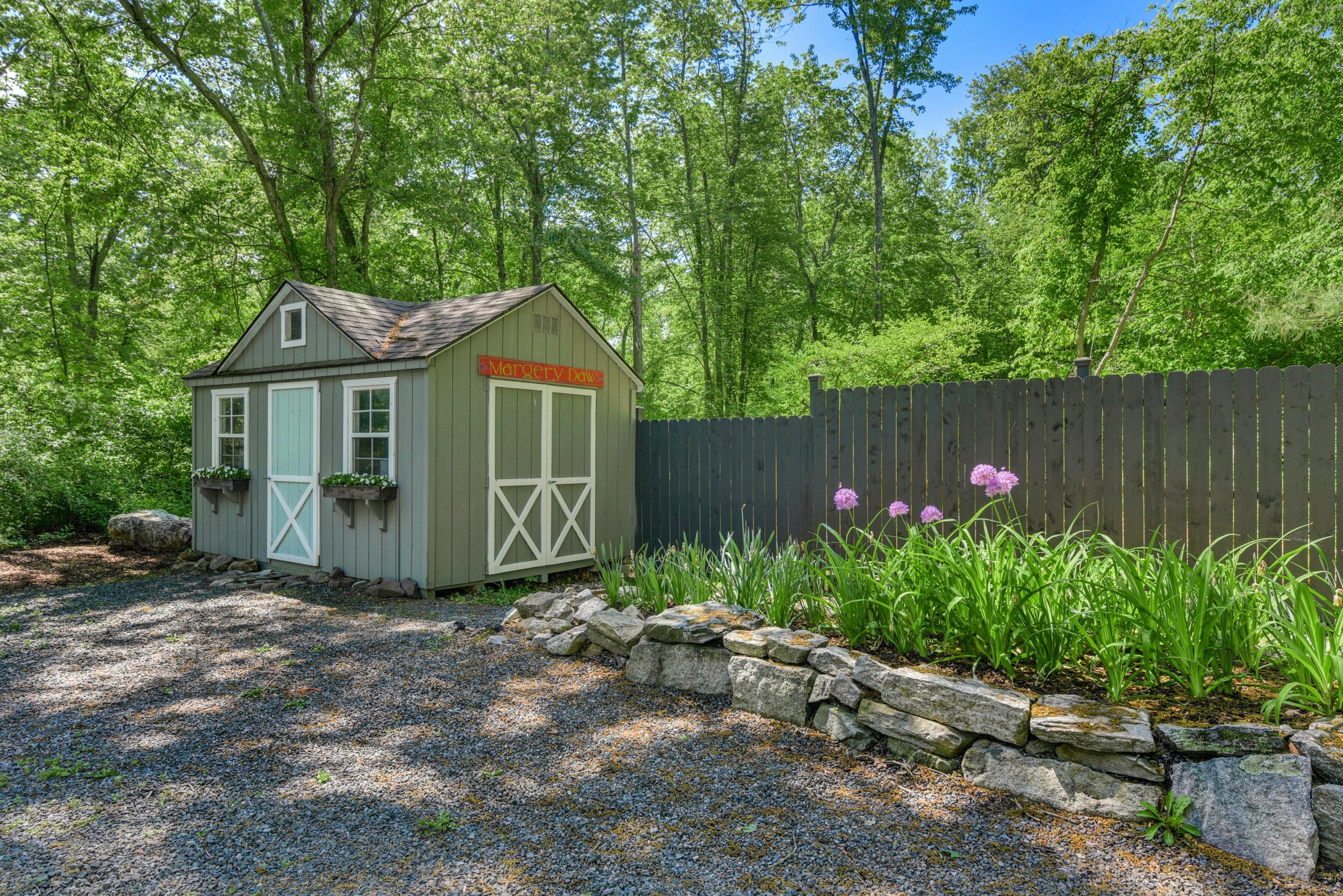 93 Westport Road Wilton, CT 06897 - Photo 24 of 31 a front view of a house with garden