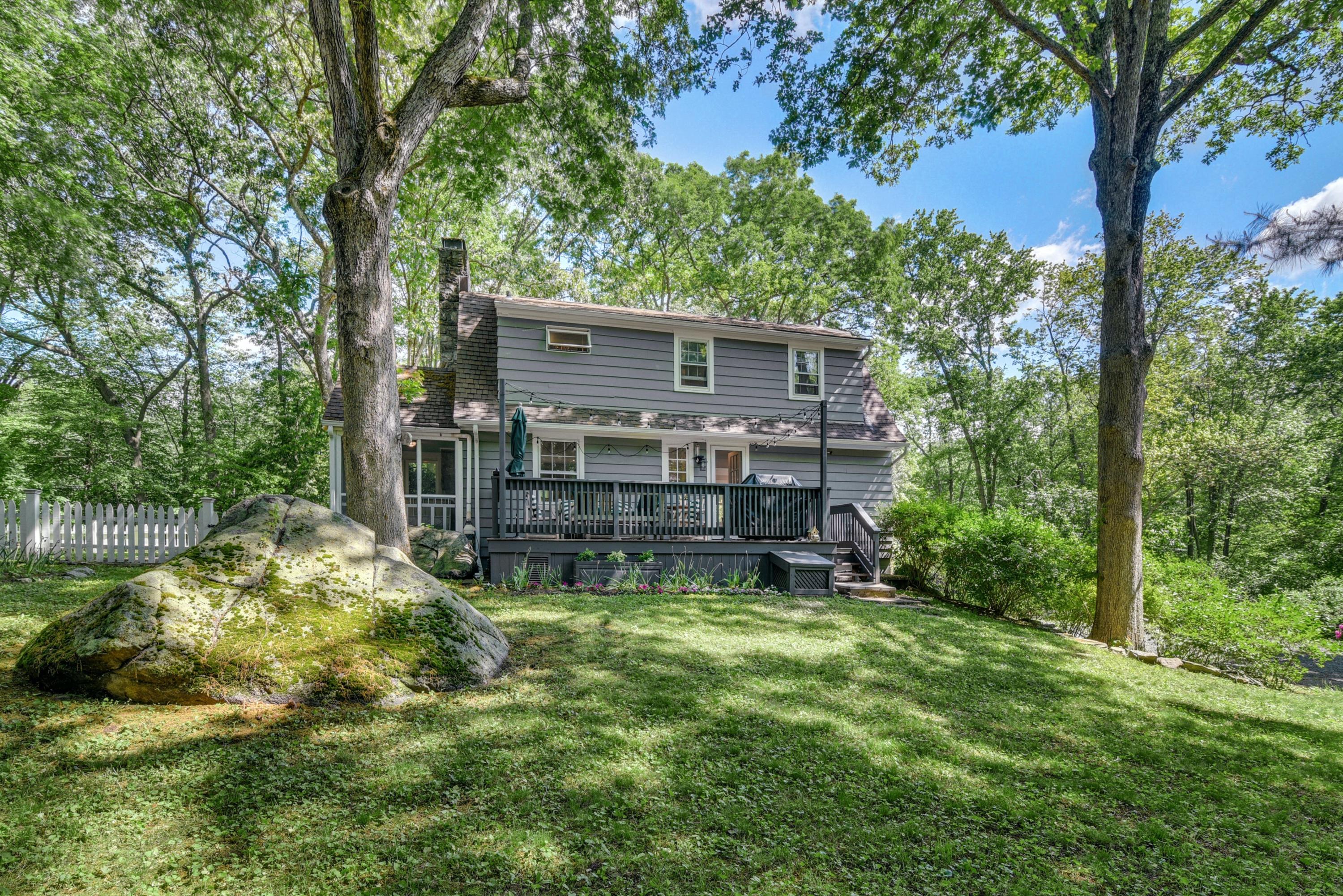 93 Westport Road Wilton, CT 06897 - Photo 25 of 31 a view of a house with a small yard and tree