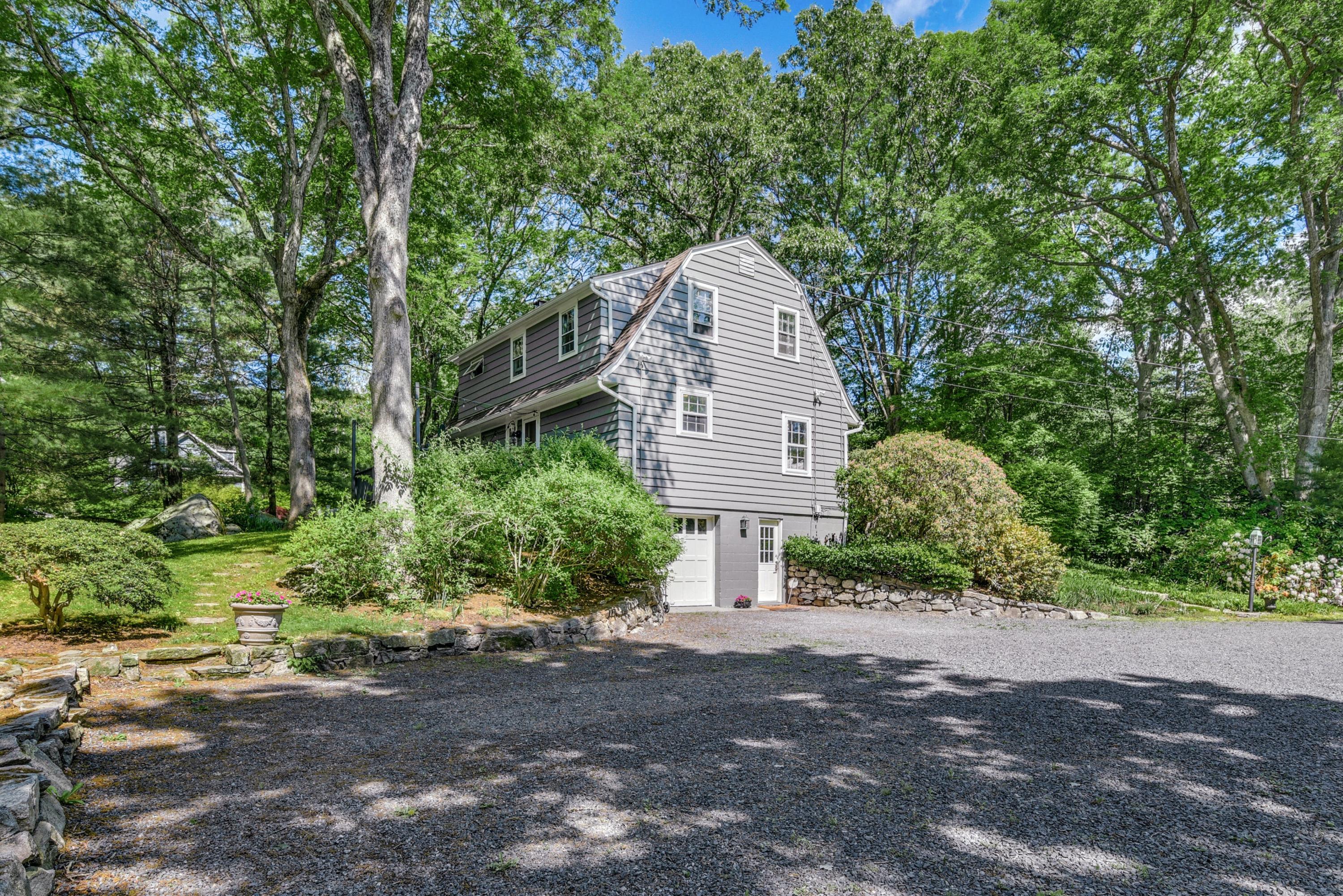 93 Westport Road Wilton, CT 06897 - Photo 26 of 31 a view of a house with a backyard
