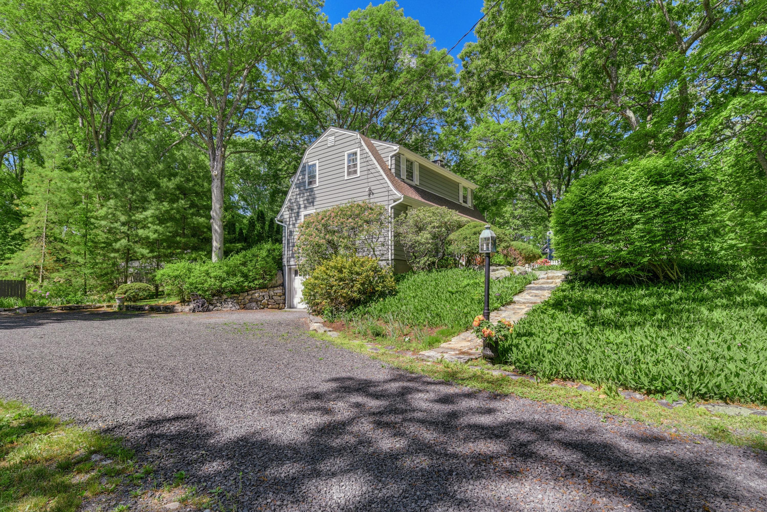 93 Westport Road Wilton, CT 06897 - Photo 27 of 31 a front view of a house with garden