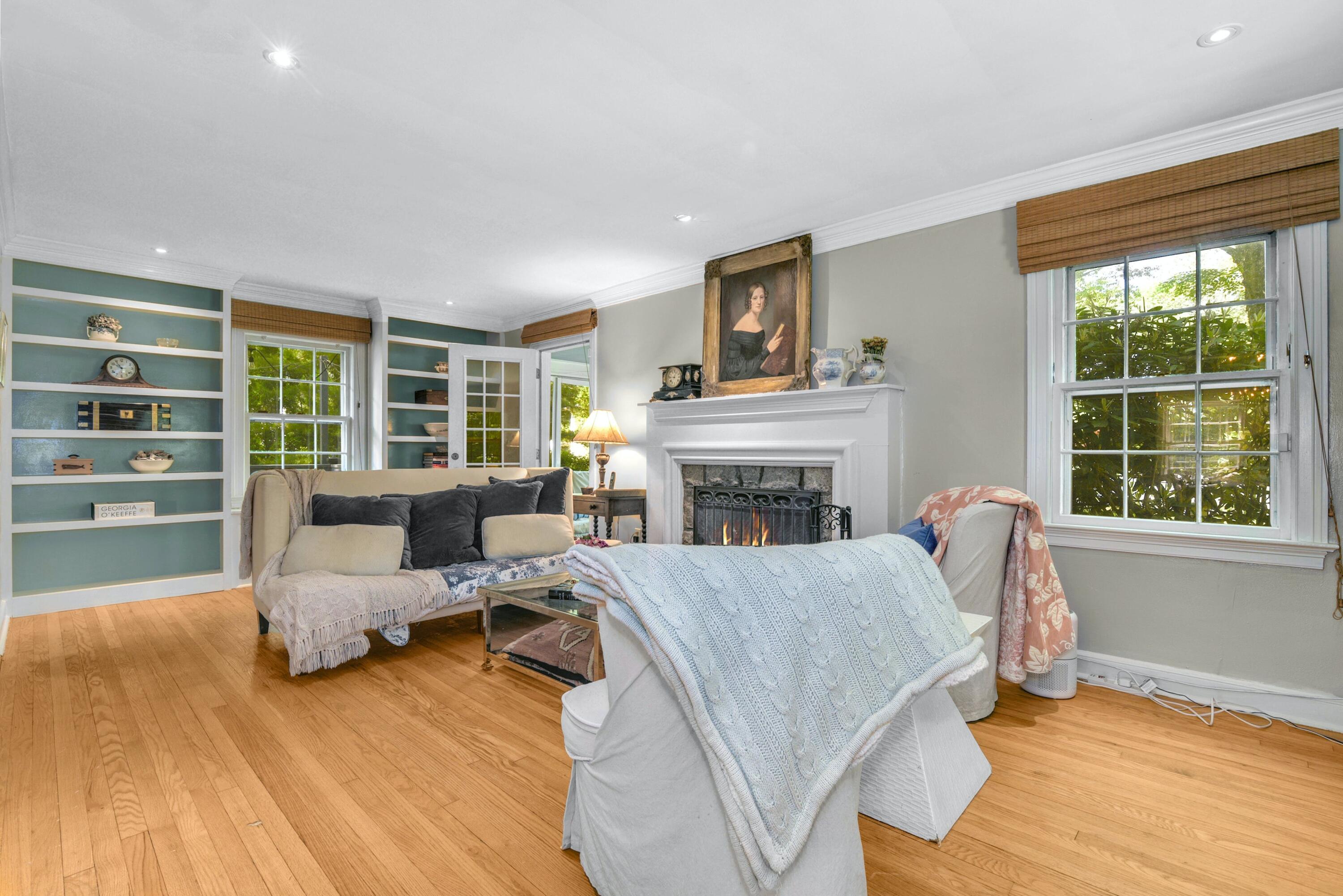 93 Westport Road Wilton, CT 06897 - Photo 5 of 31 a living room with furniture and a fireplace