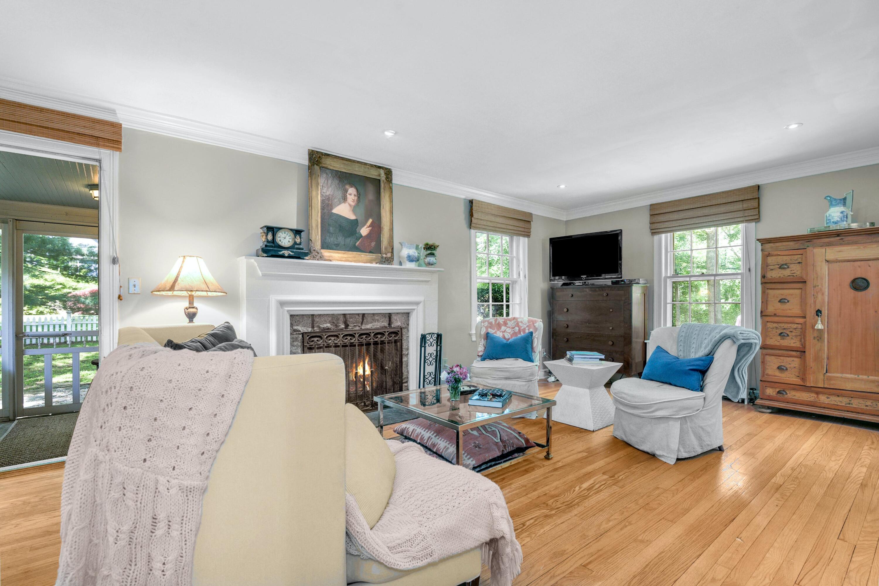 93 Westport Road Wilton, CT 06897 - Photo 6 of 31 a living room with furniture and a fireplace