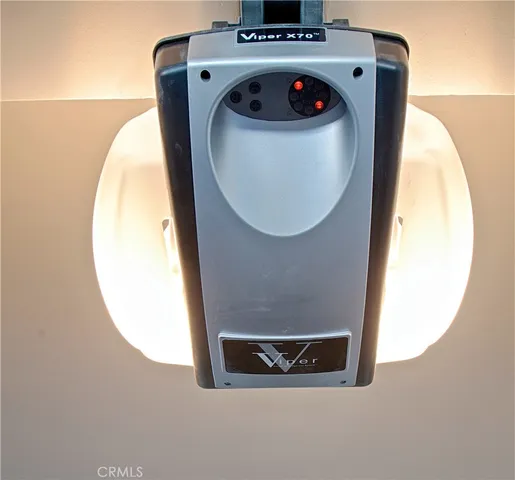 a living room with furniture a flat screen tv and a window