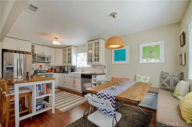 a view of a dining room with furniture and window