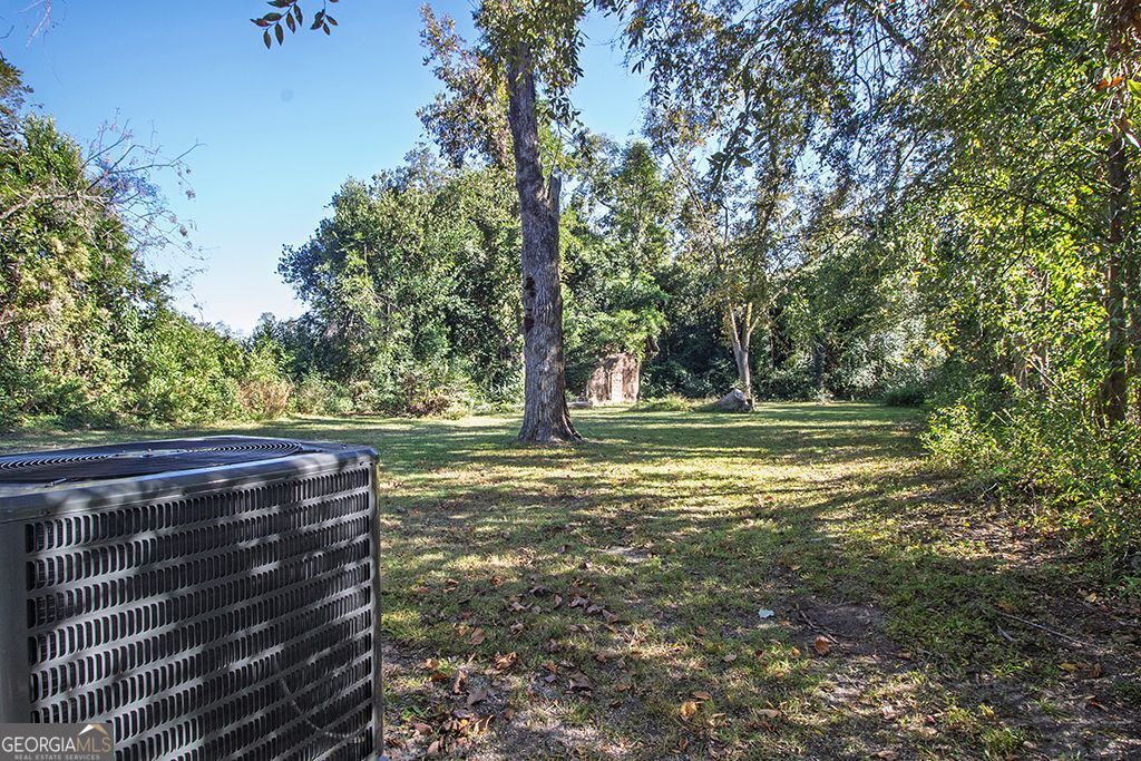 65 East Calhoun Street Wadley, GA 30477 - Photo 20 of 25 a view of outdoor space with deck and yard