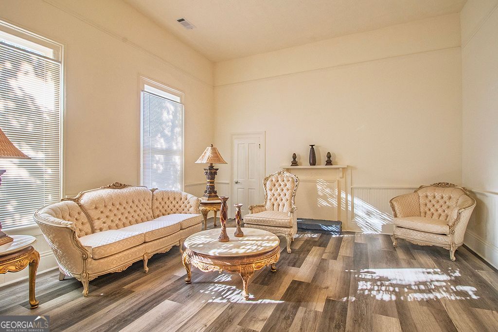 65 East Calhoun Street Wadley, GA 30477 - Photo 5 of 25 a living room with a couch and a table