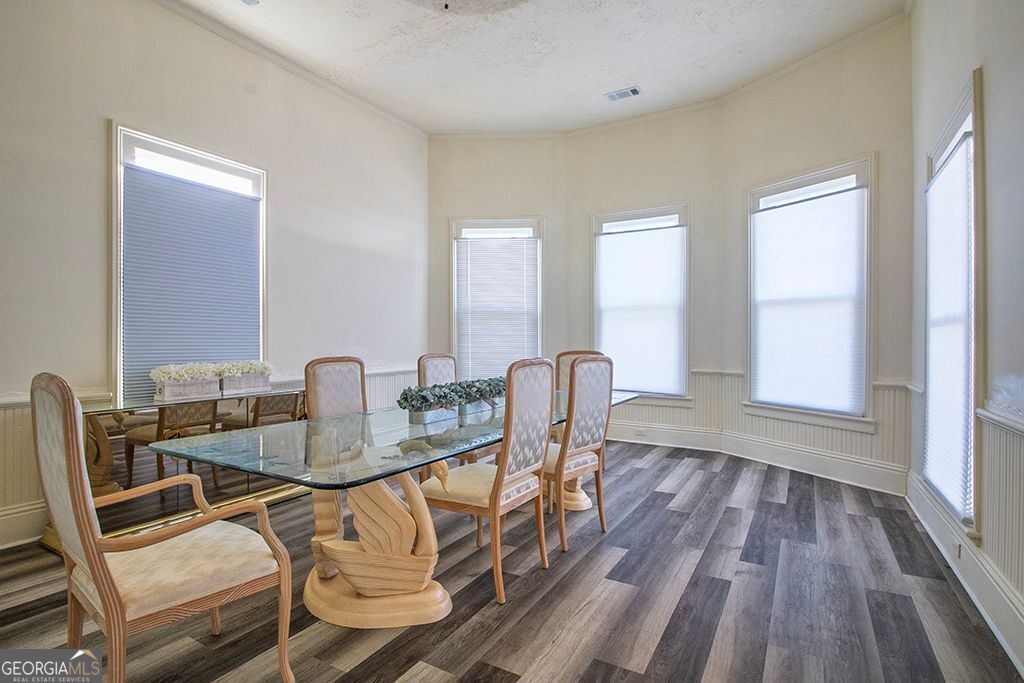 65 East Calhoun Street Wadley, GA 30477 - Photo 9 of 25 a dining room with furniture and wooden floor