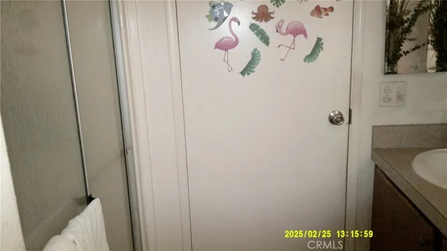 a bathroom with a shower and a sink