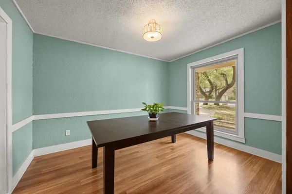 a room with furniture and wooden floor