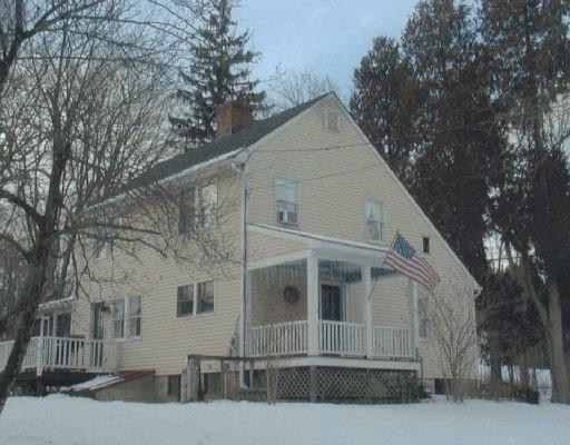 61 South Kent Road New Milford, CT 06755 - Photo 1 of 1 a view of a white house with a large tree
