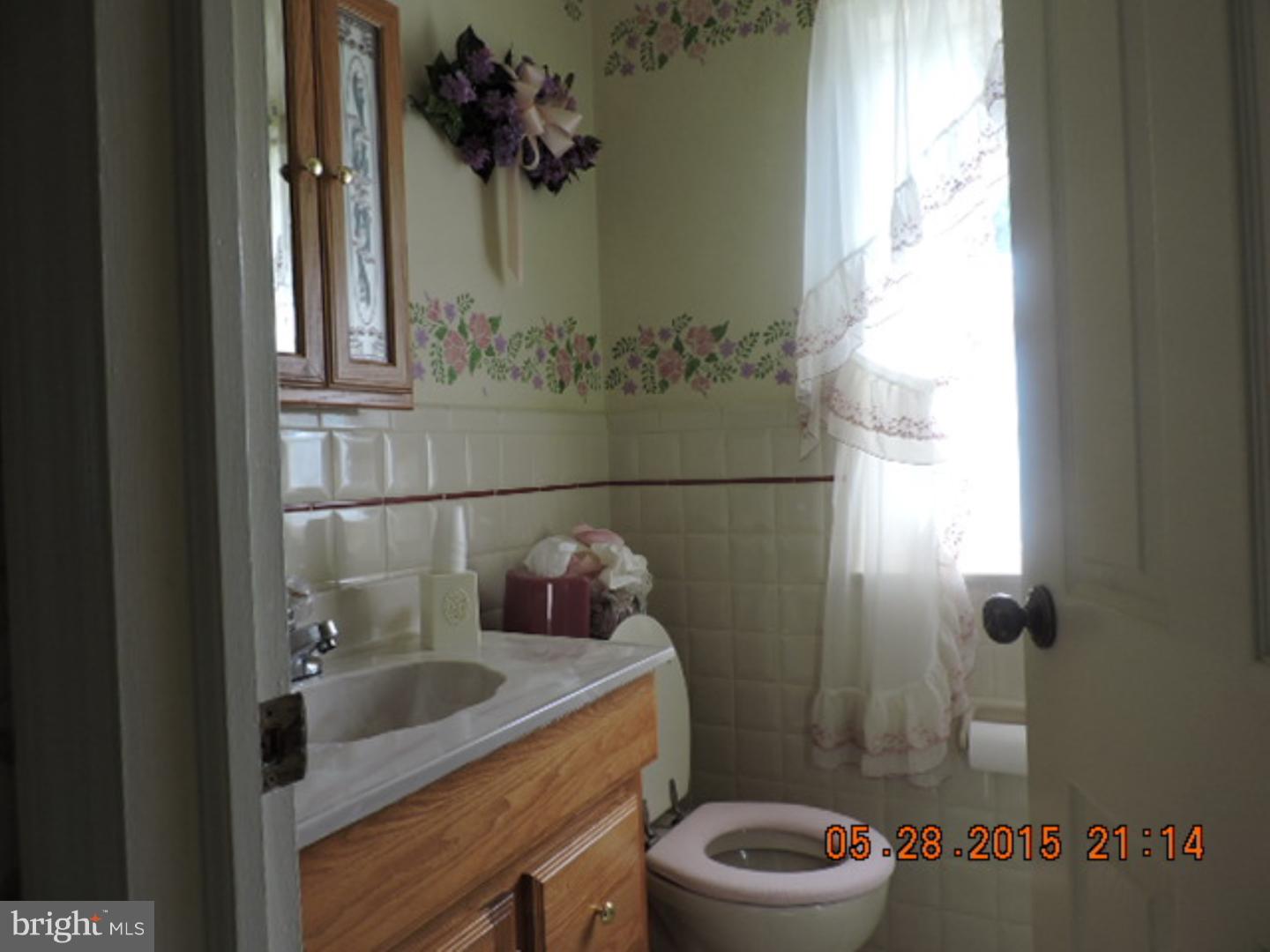 324 Gibbons Road Springfield, PA 19064 - Photo 14 of 25 a bathroom with a sink a toilet and shower