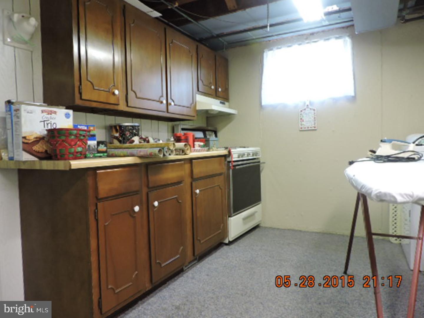 324 Gibbons Road Springfield, PA 19064 - Photo 22 of 25 a kitchen with refrigerator and cabinets
