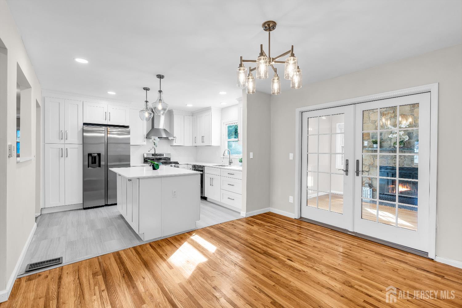 1322 Marcella Drive Union, NJ 07083 - Photo 14 of 48 a open kitchen with white cabinets and stainless steel appliances