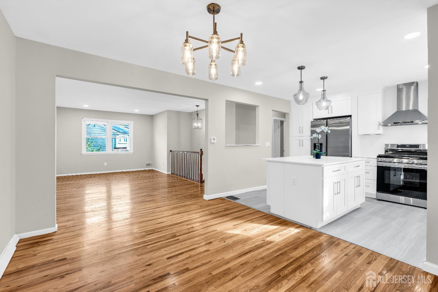 1322 Marcella Drive Union, NJ 07083 - Photo 16 of 48 a kitchen with stainless steel appliances granite countertop a sink cabinets and wooden floor