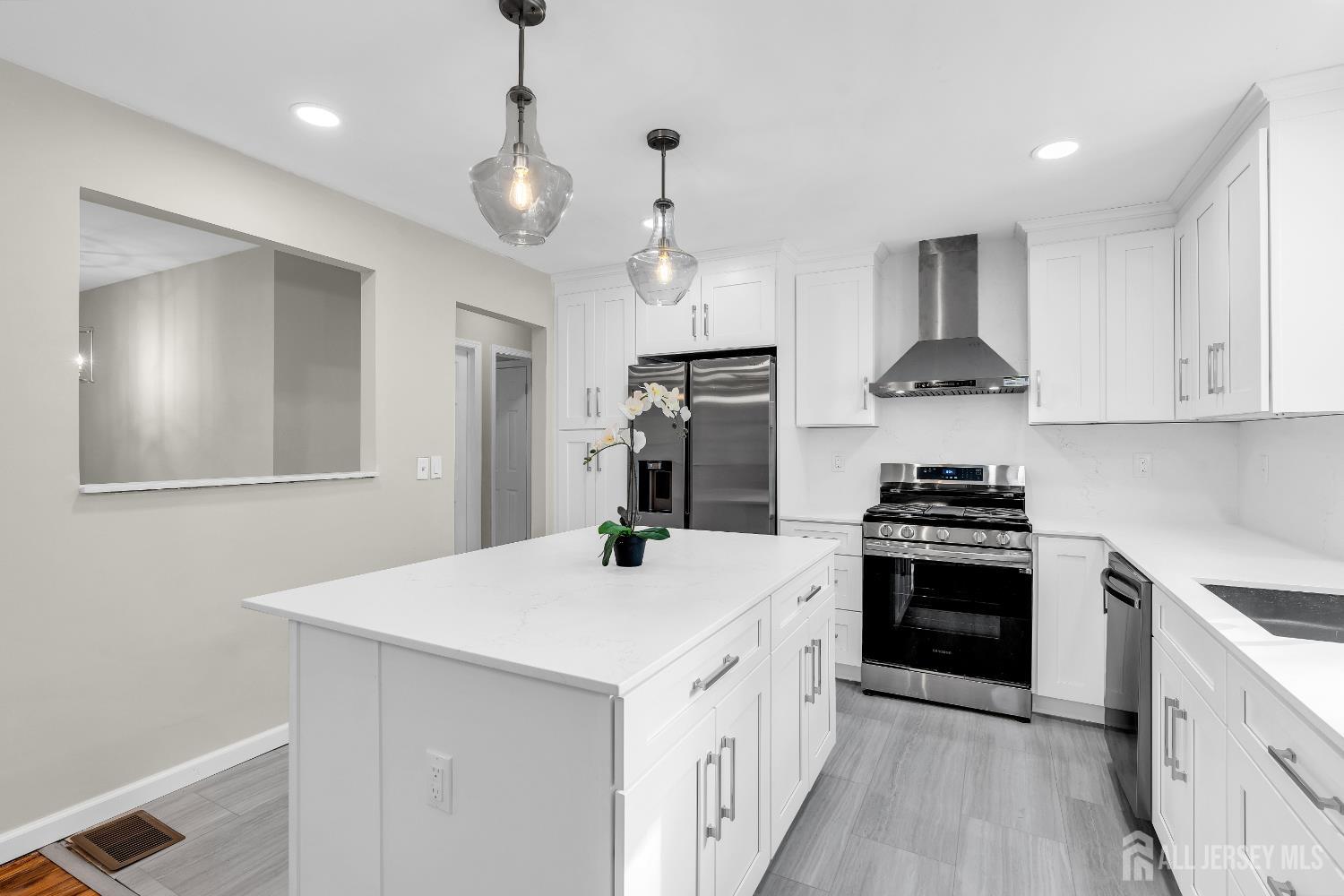 1322 Marcella Drive Union, NJ 07083 - Photo 18 of 48 a kitchen with a stove a sink and a refrigerator