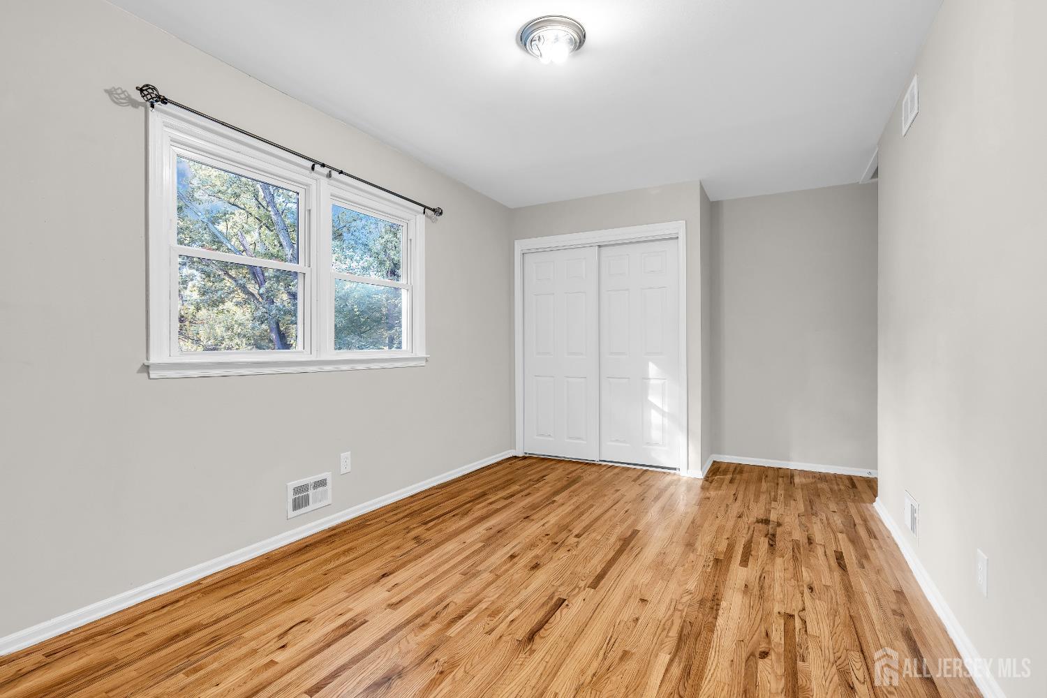 1322 Marcella Drive Union, NJ 07083 - Photo 35 of 48 a view of room with window and wooden floor