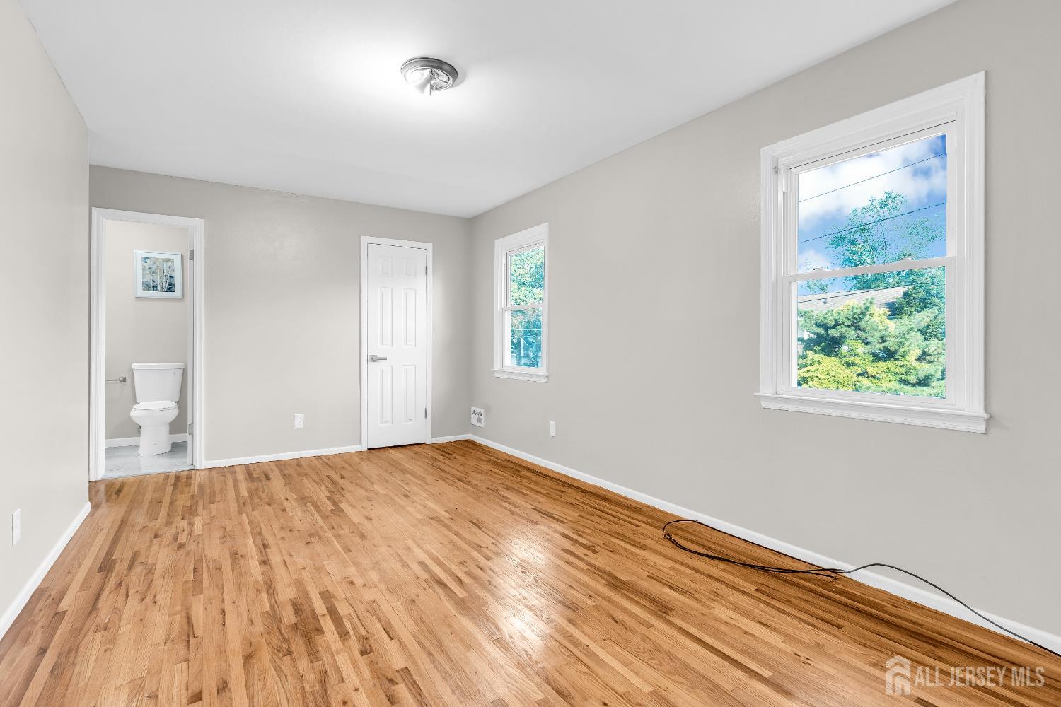 1322 Marcella Drive Union, NJ 07083 - Photo 36 of 48 a view of an empty room with wooden floor and a window