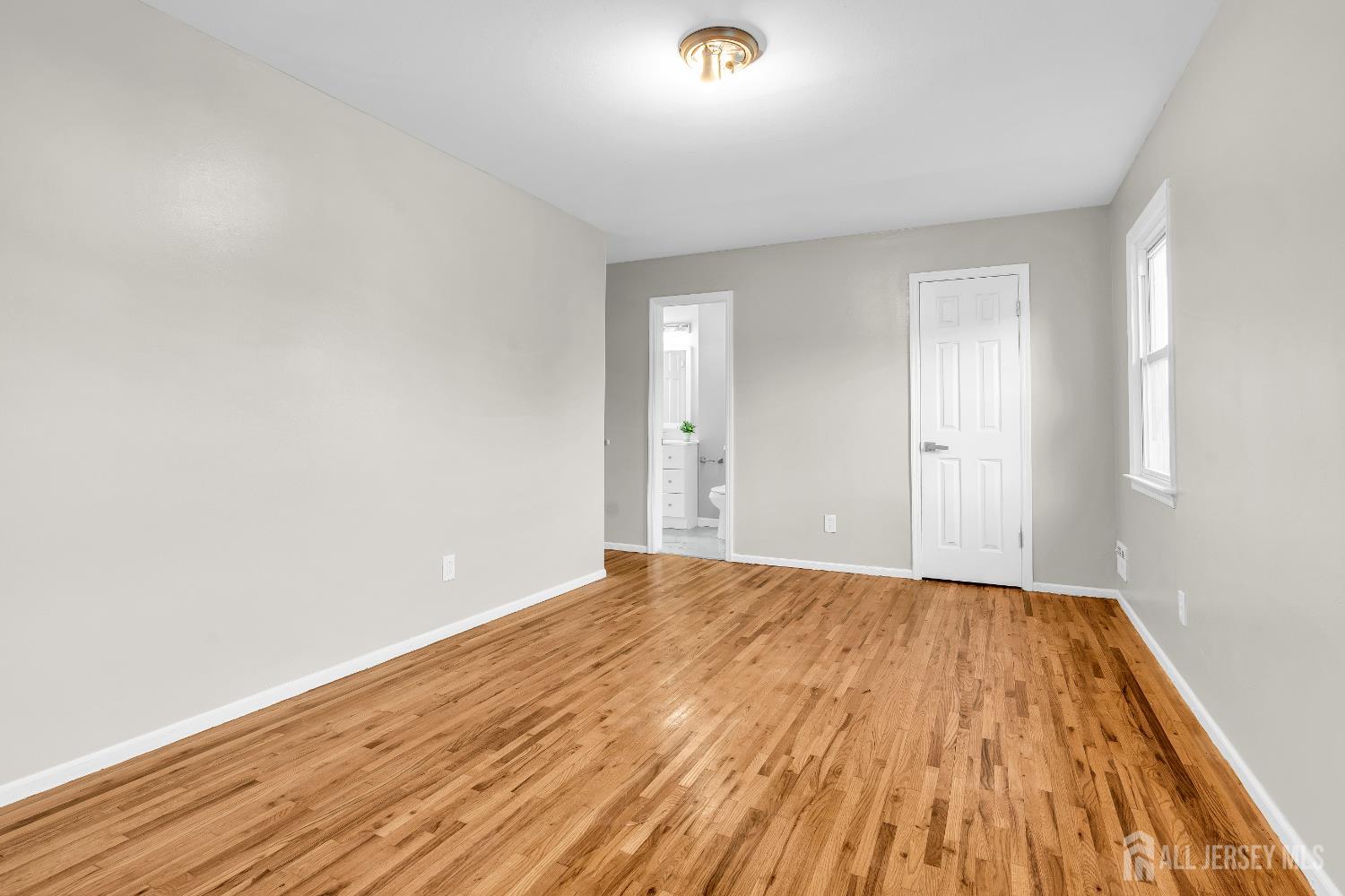 1322 Marcella Drive Union, NJ 07083 - Photo 37 of 48 a view of empty room with wooden floor and fan