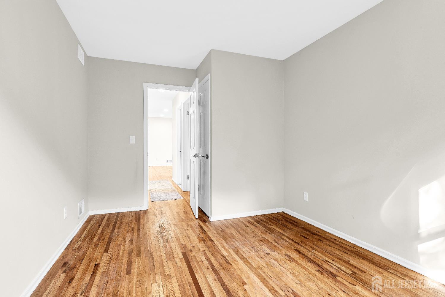 1322 Marcella Drive Union, NJ 07083 - Photo 39 of 48 a view of empty room with wooden floor